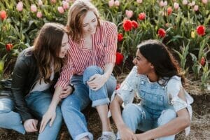 image of a teenagers smiling and laughing outside | things to do in boulder with teens family friendly visit boulder colorado